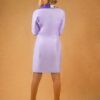 lady wearing a lavender hourglass blazer dress designed by Ria Kosher - back view
