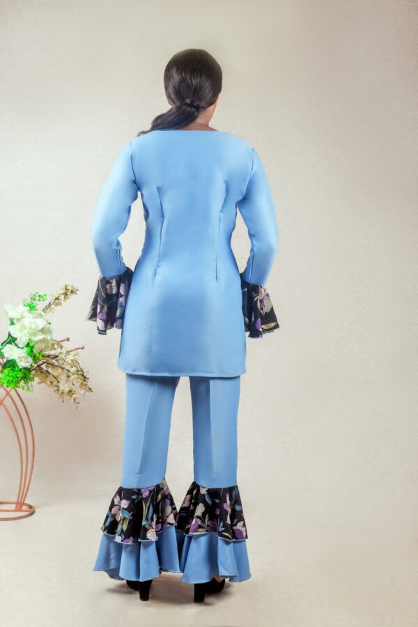 lady wearing the prisci double layered bell bottoms suit by Ria Kosher - back view