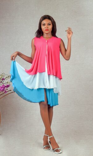 model wearing tri-coloured buttoned chiffon ruffle dress designed by Ria Kosher