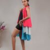 model posing tri-coloured buttoned chiffon ruffle dress designed by Ria Kosher - side view