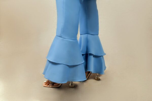 lady in pederer double layered bell bottoms suit by Ria Kosher - legs details