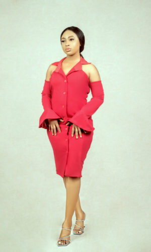 lady wearing a red bell sleeves hourglass suit dress by Ria Kosher