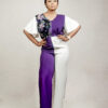 lady posing in a floral blouson jumpsuit with slit sleeves by Ria Kosher