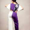 lady posing in a floral blouson jumpsuit with slit sleeves by Ria Kosher - back view