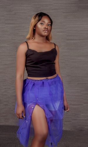 Victoria wearing black to and purple tulle skirt